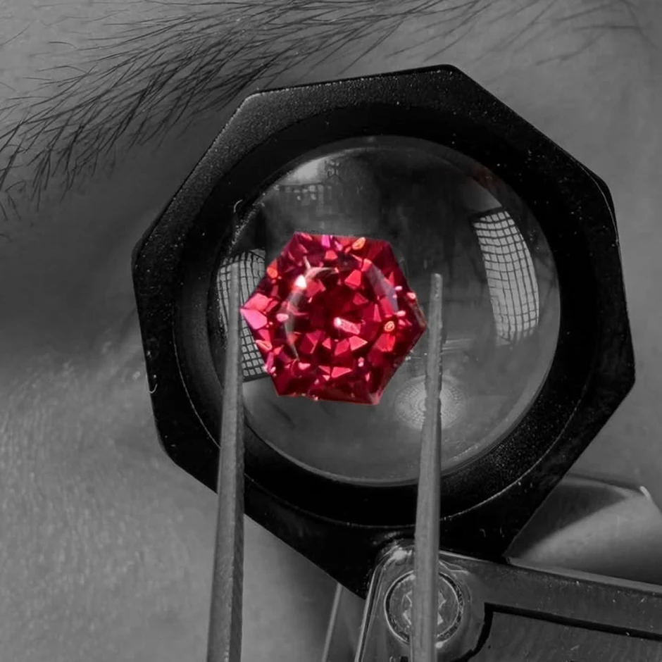 Red spinel viewed through a loupe